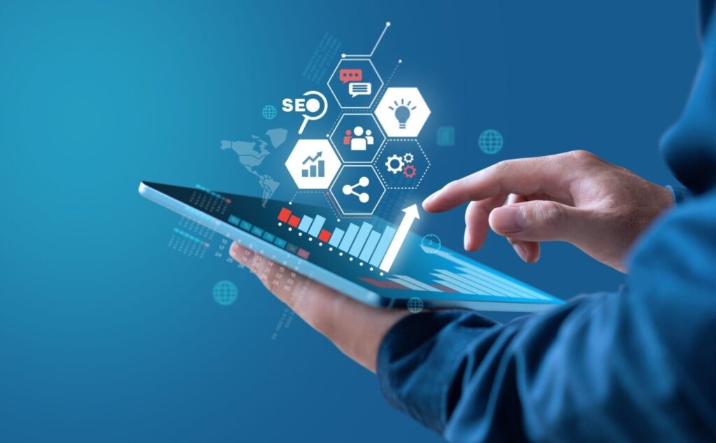 Business professional using a tablet with digital analytics and IT consulting icons to improve ROI and business performance