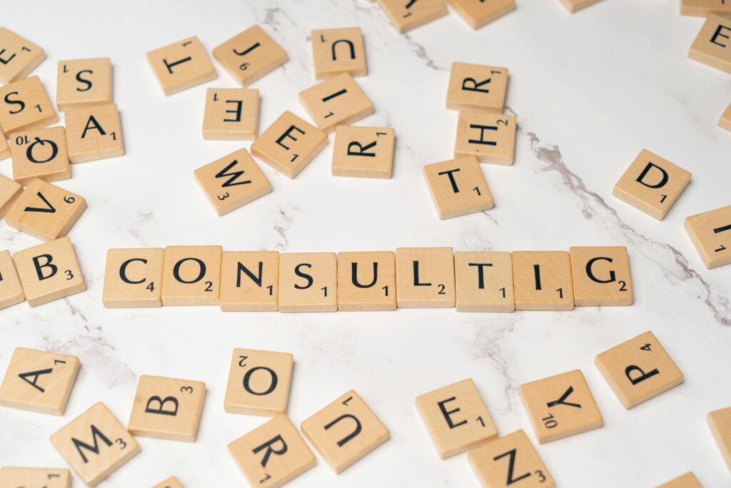 Consulting spelled with letter tiles representing signs that a business needs professional consulting support